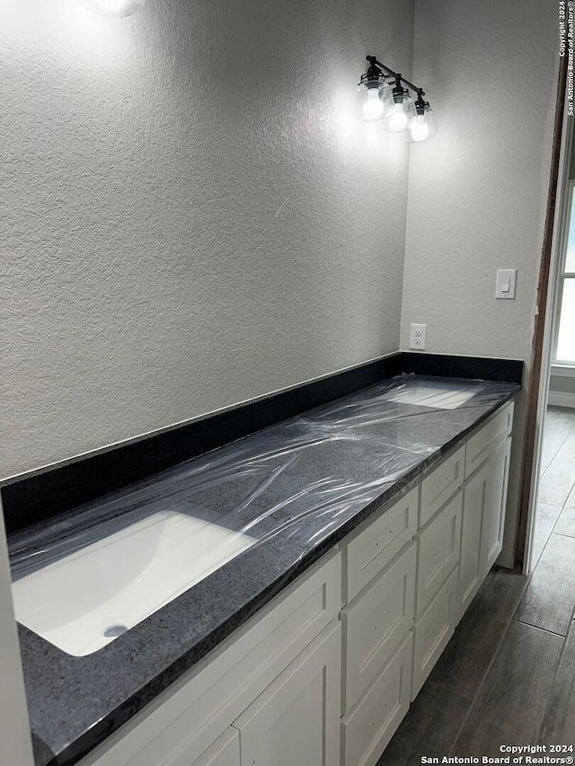 bathroom featuring wood-type flooring