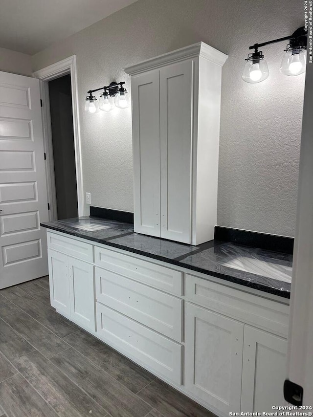 bathroom featuring wood-type flooring