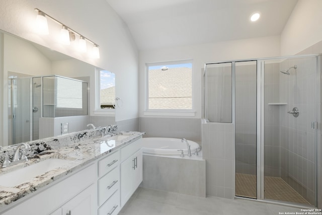 bathroom featuring vanity, lofted ceiling, and plus walk in shower