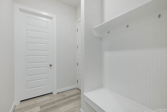 mudroom with light hardwood / wood-style floors