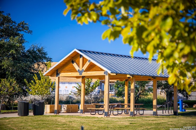 view of property's community with a gazebo and a yard