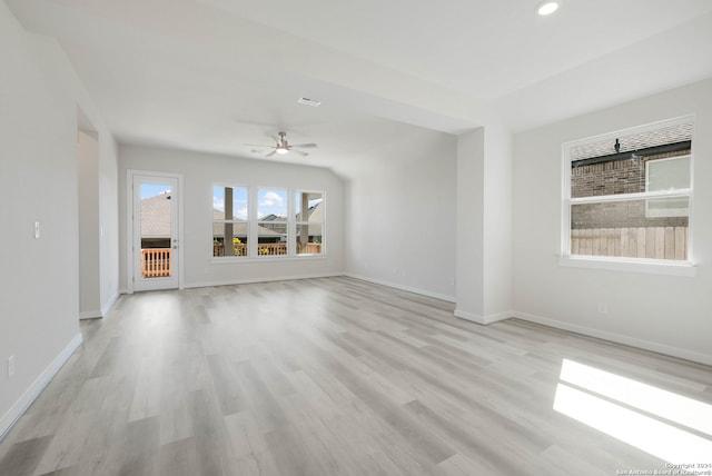 unfurnished living room with light hardwood / wood-style flooring and ceiling fan