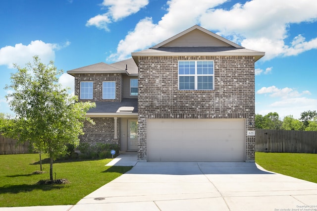 view of front property with a front lawn and a garage