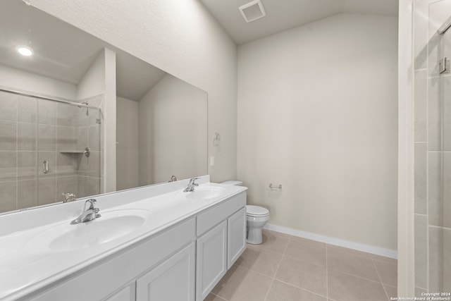 bathroom with toilet, tile patterned flooring, an enclosed shower, and vanity