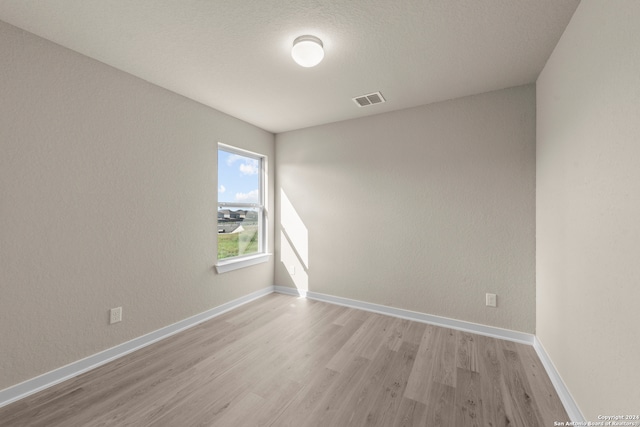 empty room featuring light hardwood / wood-style floors