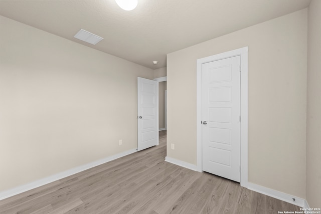 unfurnished bedroom with light hardwood / wood-style floors