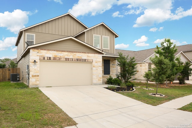 craftsman-style home with a garage, central air condition unit, and a front lawn