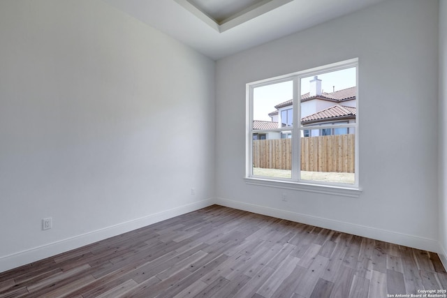 8214 Sierra Hermosa, San Antonio, TX 78255 - unfurnished room featuring healthy amount of natural light, wood finished floors, and baseboards