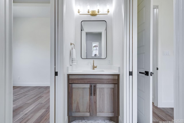 8214 Sierra Hermosa, San Antonio, TX 78255 - bathroom featuring wood finished floors, vanity, and baseboards