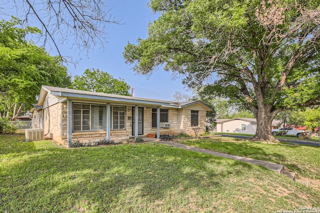 ranch-style home featuring a front yard