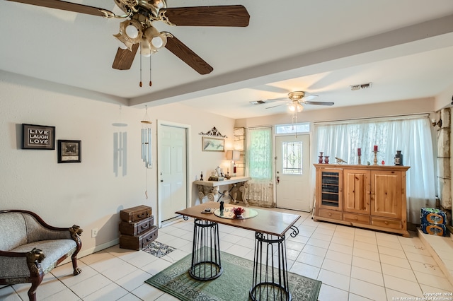 tiled living room with ceiling fan