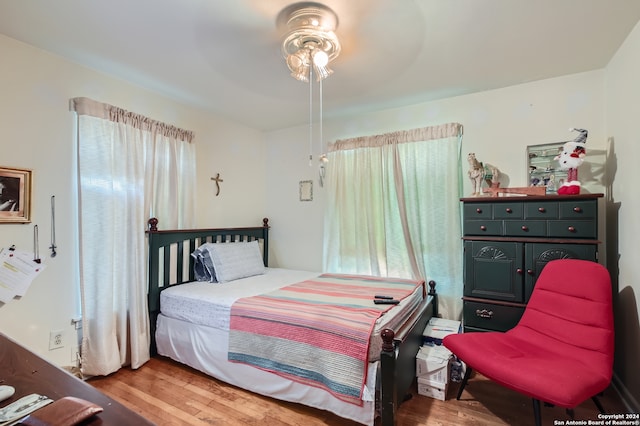 bedroom featuring light hardwood / wood-style flooring and ceiling fan