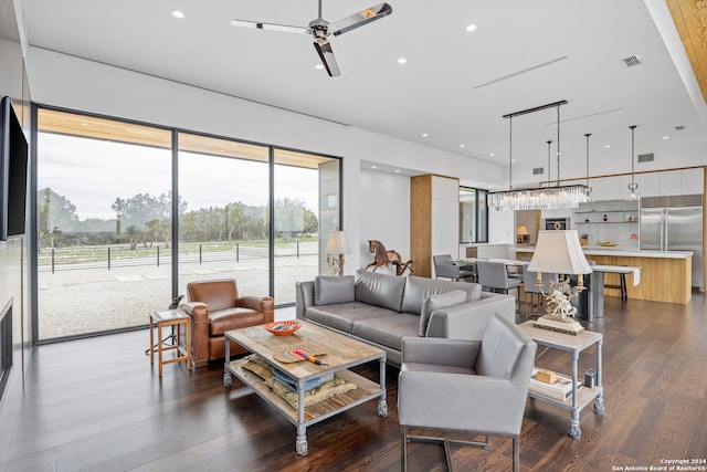 living room with dark wood-type flooring and ceiling fan