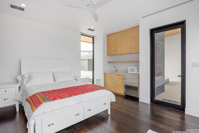 bedroom with dark wood-type flooring, sink, and ceiling fan