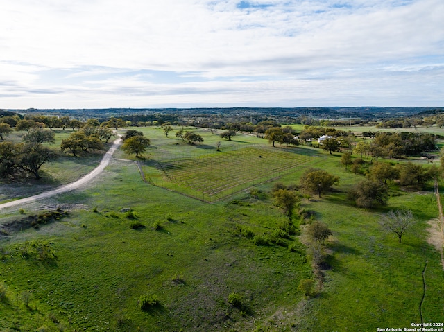 birds eye view of property featuring a rural view