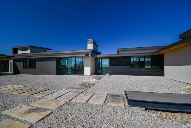 back of property featuring a patio area