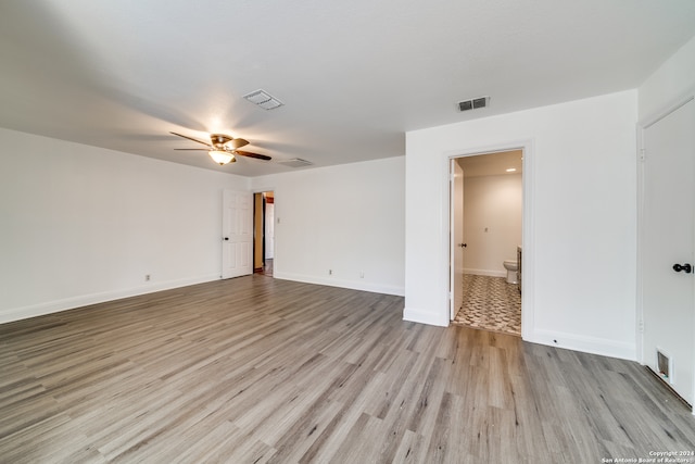 spare room with light hardwood / wood-style floors and ceiling fan