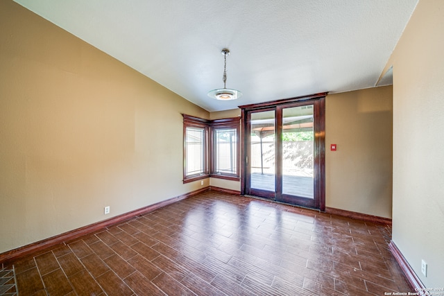 unfurnished room featuring dark hardwood / wood-style floors