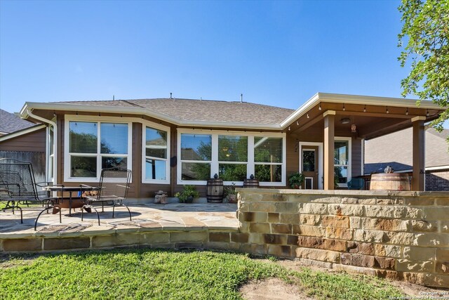 rear view of property featuring a patio