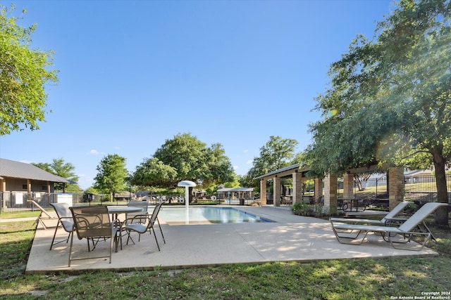 view of swimming pool featuring a patio area