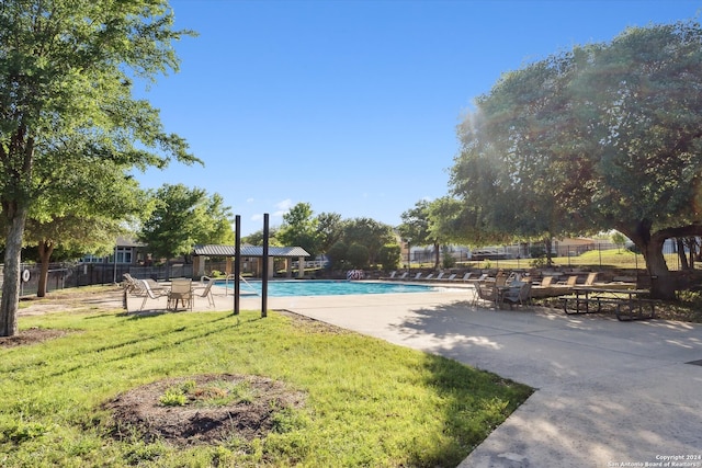 exterior space featuring a patio area and a community pool