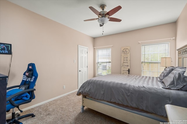 carpeted bedroom with ceiling fan