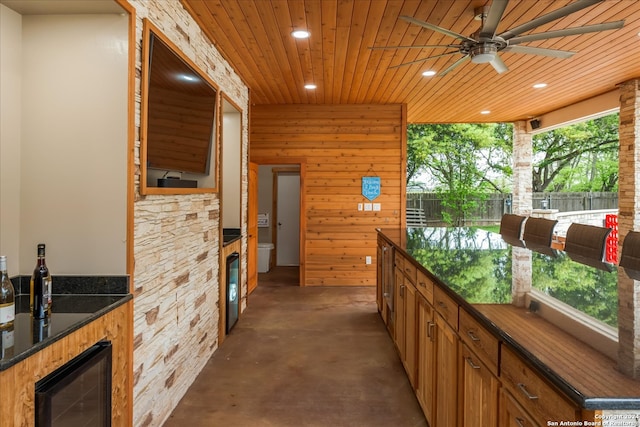 view of patio featuring wine cooler and ceiling fan