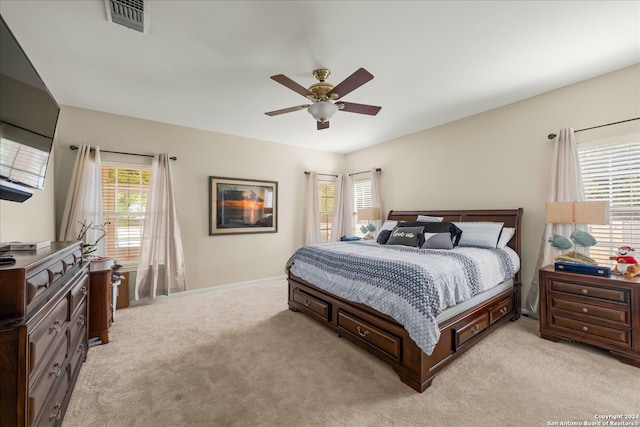 carpeted bedroom with ceiling fan