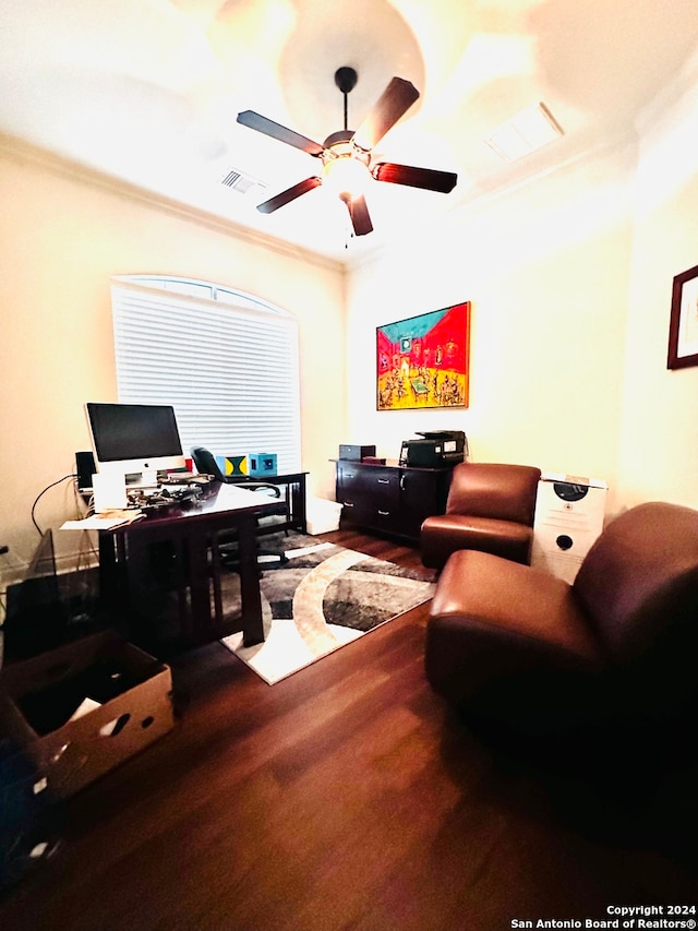 office area with crown molding, wood-type flooring, and ceiling fan