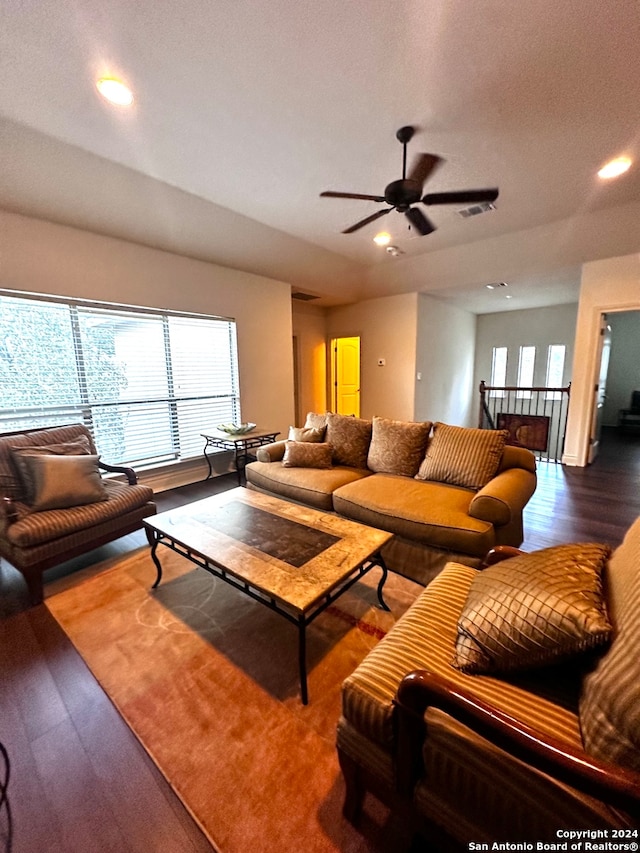 living room with ceiling fan and wood-type flooring