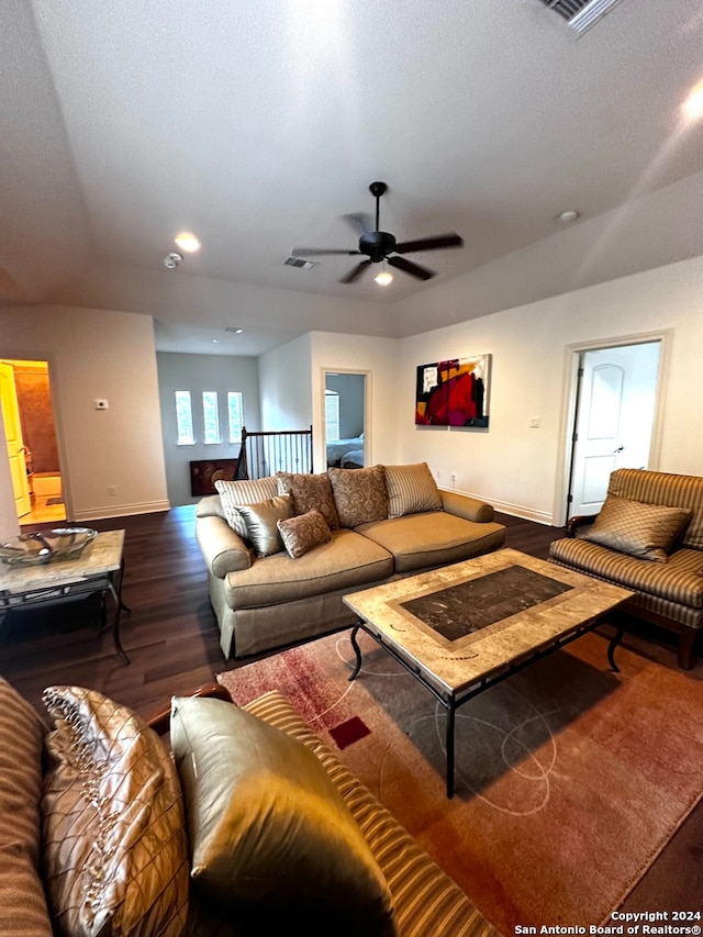 living room with wood-type flooring and ceiling fan