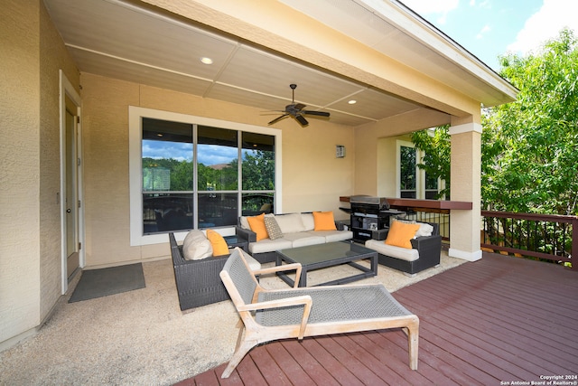 wooden deck with ceiling fan and an outdoor hangout area