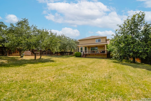 view of yard with a deck