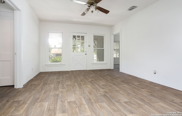 unfurnished room featuring wood-type flooring and ceiling fan