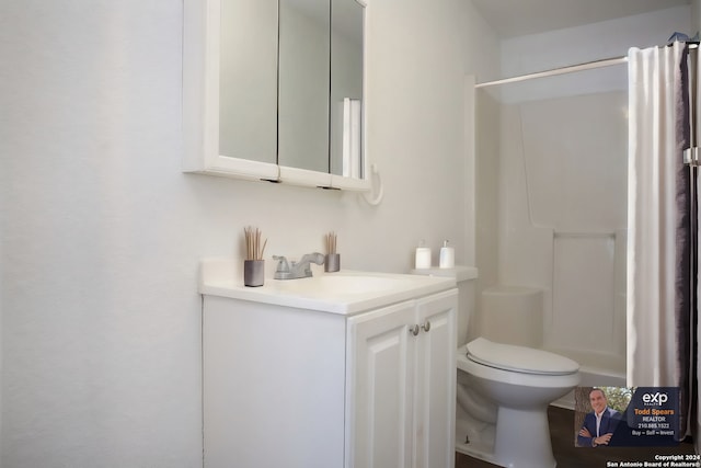 bathroom with vanity with extensive cabinet space and toilet