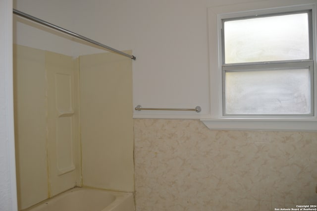 bathroom featuring shower / bath combination and plenty of natural light