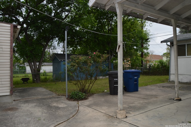 view of patio / terrace with a storage unit