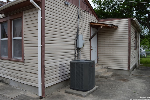 view of side of home featuring central air condition unit