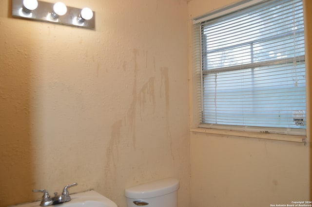 bathroom featuring sink and toilet