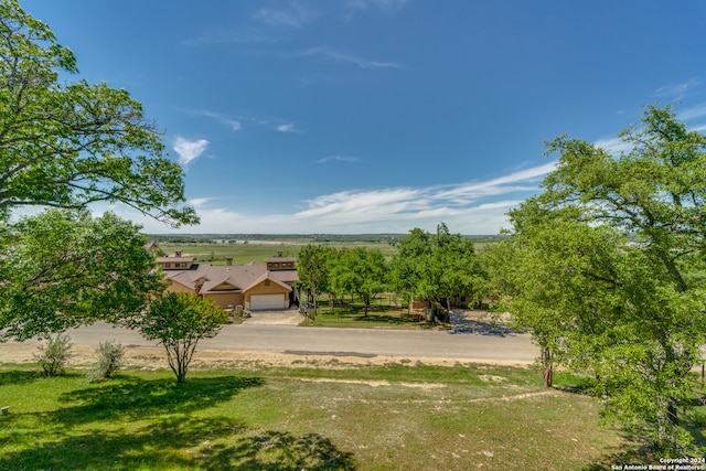 view of yard with a rural view