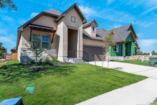 view of front facade featuring a garage and a front yard