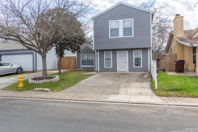 view of front property featuring a front yard and a garage