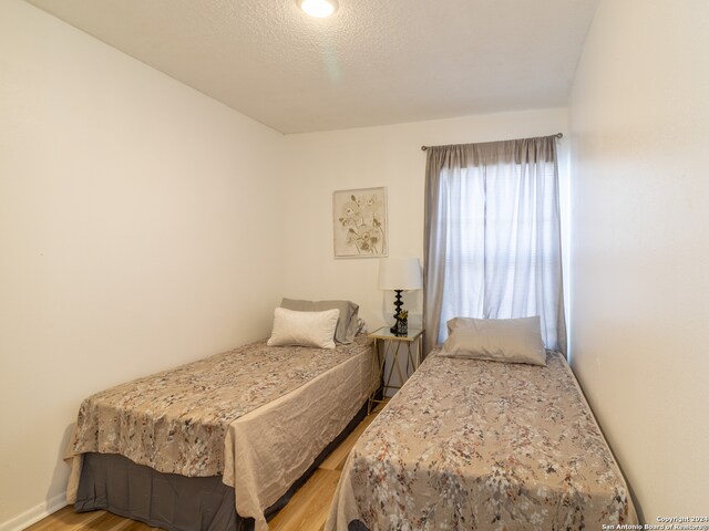 bedroom featuring light wood-type flooring