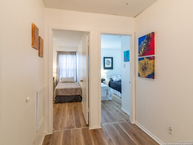 corridor featuring hardwood / wood-style flooring