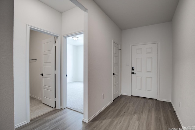 corridor featuring light hardwood / wood-style flooring