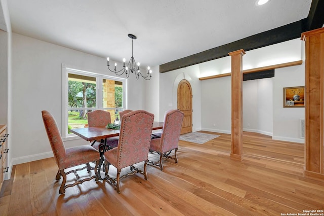 dining space with a notable chandelier, light hardwood / wood-style flooring, beamed ceiling, and decorative columns