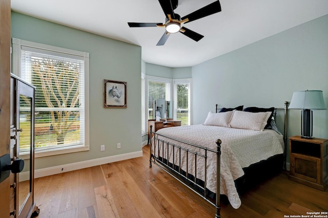 bedroom featuring hardwood / wood-style floors and ceiling fan