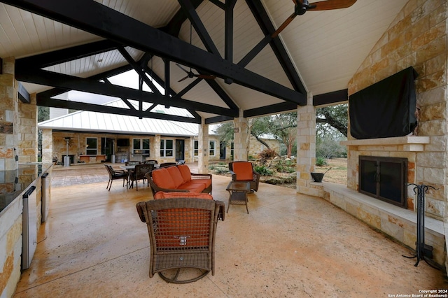 view of patio / terrace with an outdoor living space with a fireplace, a gazebo, and ceiling fan