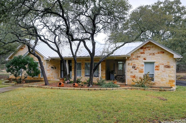 ranch-style house featuring a front lawn