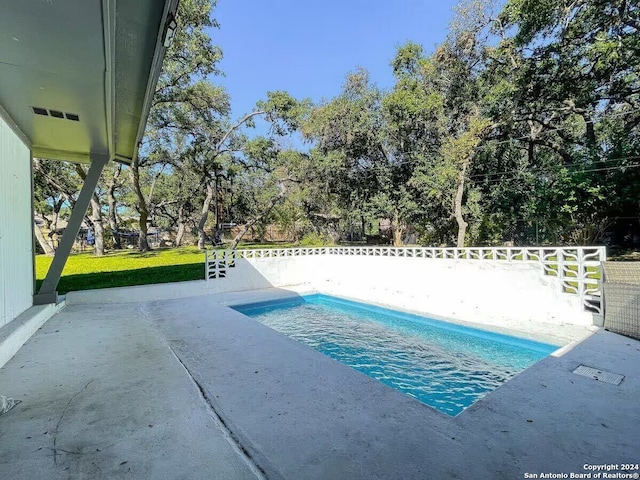 view of pool featuring a patio